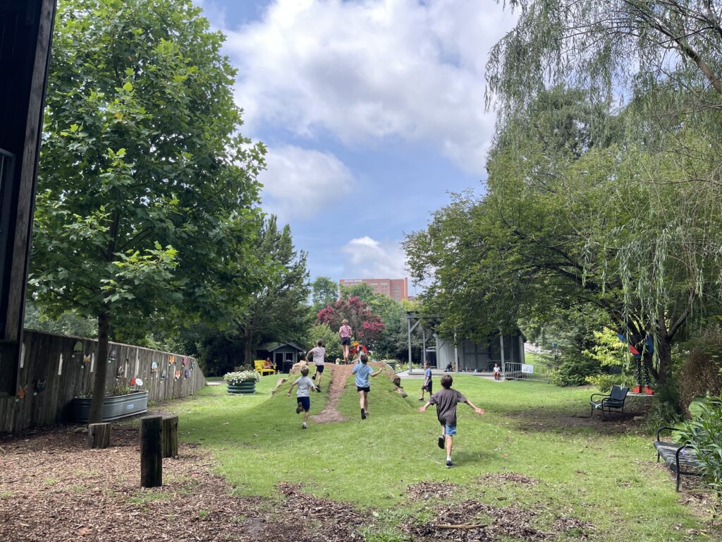 Children running in a garden